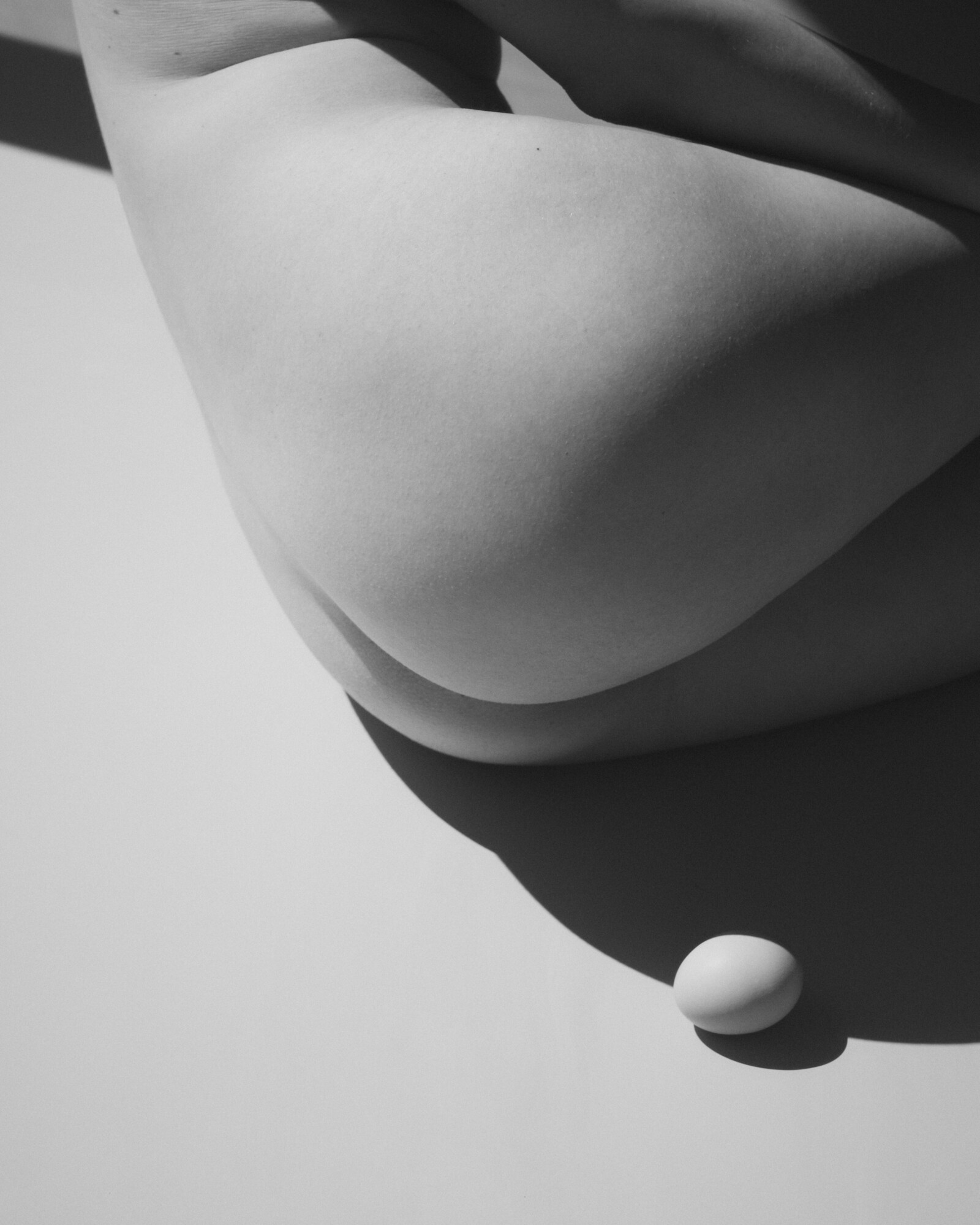 Female nude with egg in black and white